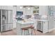 Modern kitchen with stainless steel appliances and a stylish island with bar seating at 18 Tupelo Trl, Edisto Island, SC 29438