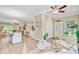 Open concept living area with views to the dining, kitchen and sunroom and a neutral color palette at 18 Tupelo Trl, Edisto Island, SC 29438