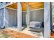 Outdoor patio area featuring a swing and gray wood slat walls at 18 Tupelo Trl, Edisto Island, SC 29438