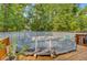 Wooden deck with a covered pool offering an outdoor space for relaxation and leisure at 18 Tupelo Trl, Edisto Island, SC 29438