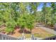 A dense tree canopy towers over the elevated home at 18 Tupelo Trl, Edisto Island, SC 29438