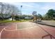 Community basketball court with a playground and pond views, creating a fun and active environment for all ages at 2011 N Highway 17 # 1400A, Mount Pleasant, SC 29466