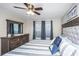 Comfortable bedroom featuring a ceiling fan, hardwood floors, and a large dresser at 2011 N Highway 17 # 1400A, Mount Pleasant, SC 29466