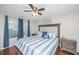 Inviting bedroom with hardwood floors, ceiling fan, and natural light from the window at 2011 N Highway 17 # 1400A, Mount Pleasant, SC 29466