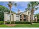 Well-maintained building with brick accents, tidy landscaping, and mature palm trees at 2011 N Highway 17 # 1400A, Mount Pleasant, SC 29466