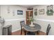Cozy dining area includes a rustic table and chairs, decorative wall art, and wood floors at 2011 N Highway 17 # 1400A, Mount Pleasant, SC 29466