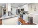 Modern kitchen with stainless steel appliances, granite countertops, and bright white cabinetry at 2011 N Highway 17 # 1400A, Mount Pleasant, SC 29466