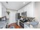 Updated kitchen with stainless steel appliances, white cabinets, and granite countertops at 2011 N Highway 17 # 1400A, Mount Pleasant, SC 29466
