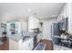 Updated kitchen showcasing sleek white cabinets, granite counters, and stainless steel appliances at 2011 N Highway 17 # 1400A, Mount Pleasant, SC 29466
