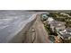 Scenic aerial view of beachfront properties with ocean on one side and coastline on the other at 210 Ocean Blvd, Isle of Palms, SC 29451