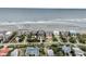 Breathtaking aerial view of beachfront homes lining the coast with ocean backdrop at 210 Ocean Blvd, Isle of Palms, SC 29451