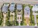 Aerial view of stunning homes with luxurious pools and well-manicured landscaping, perfect for coastal living at 210 Ocean Blvd, Isle of Palms, SC 29451