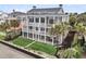 Expansive three-story beach house with multiple decks, providing ocean views at 210 Ocean Blvd, Isle of Palms, SC 29451