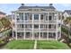 Three-story house boasts multiple decks, offering amazing views and outdoor living spaces at 210 Ocean Blvd, Isle of Palms, SC 29451