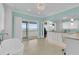 Open bathroom with a tub, counter, and walk-out porch at 210 Ocean Blvd, Isle of Palms, SC 29451