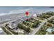 Beachfront home with well-manicured landscaping and a nearby pool, offering luxurious coastal living at 210 Ocean Blvd, Isle of Palms, SC 29451
