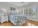 Bright bedroom with white shutters provides natural light and a serene atmosphere for relaxation at 210 Ocean Blvd, Isle of Palms, SC 29451
