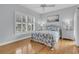 Comfortable bedroom with plantation shutters and coastal decor for a relaxed, beach-inspired ambiance at 210 Ocean Blvd, Isle of Palms, SC 29451