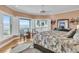 Primary bedroom with a ceiling fan, large rug, and ocean views at 210 Ocean Blvd, Isle of Palms, SC 29451