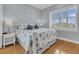 Cozy bedroom with stylish white shutters, marine accents, and a peaceful ambiance for restful nights at 210 Ocean Blvd, Isle of Palms, SC 29451