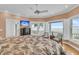 Primary bedroom with a ceiling fan and ocean views at 210 Ocean Blvd, Isle of Palms, SC 29451