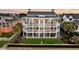 Spacious multi-story beach house featuring multiple balconies for enjoying scenic views and outdoor living at 210 Ocean Blvd, Isle of Palms, SC 29451