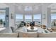 Cozy living room with large windows offering ocean views and comfortable seating at 210 Ocean Blvd, Isle of Palms, SC 29451