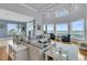 Open-concept living room with ocean view, comfortable seating, and a bright, airy feel at 210 Ocean Blvd, Isle of Palms, SC 29451