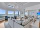 Spacious living room with ocean view and a plush, sectional sofa at 210 Ocean Blvd, Isle of Palms, SC 29451