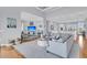 Bright and airy living room featuring a large sectional sofa and coastal decor at 210 Ocean Blvd, Isle of Palms, SC 29451