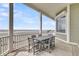 Outdoor patio with a dining table overlooking the ocean at 210 Ocean Blvd, Isle of Palms, SC 29451