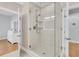 Walk-in shower features sleek glass enclosure and modern fixtures, enhancing the luxurious bathroom experience at 210 Ocean Blvd, Isle of Palms, SC 29451