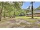 Spacious backyard featuring a swing set, a tree swing, and a lush green lawn at 213 Turtle Point Rd, Summerville, SC 29483
