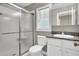 Well-lit bathroom with granite countertop vanity, shower, and toilet at 213 Turtle Point Rd, Summerville, SC 29483