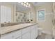 Bright bathroom with white cabinets, marble countertops, and modern fixtures at 213 Turtle Point Rd, Summerville, SC 29483