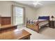 Charming bedroom featuring a four-poster bed frame, ceiling fan, and natural light at 213 Turtle Point Rd, Summerville, SC 29483