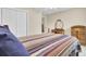 Comfortable bedroom with warm tones, featuring classic furnishings and ample closet space at 213 Turtle Point Rd, Summerville, SC 29483