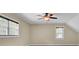 This bedroom has neutral walls, two windows with black blinds, and a ceiling fan with a light fixture at 213 Turtle Point Rd, Summerville, SC 29483