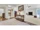Inviting entryway with wood floors, decorative rug, and views into the living room and kitchen at 213 Turtle Point Rd, Summerville, SC 29483