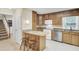 Bright kitchen with stainless steel appliances, granite countertops, and a cozy breakfast bar at 213 Turtle Point Rd, Summerville, SC 29483