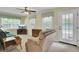 Cozy living room with comfortable seating, ceiling fan, and natural light from multiple windows at 213 Turtle Point Rd, Summerville, SC 29483