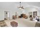 Open living room with lots of natural light, a vaulted ceiling, and cozy fireplace feature at 213 Turtle Point Rd, Summerville, SC 29483