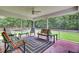 Relaxing screened porch with comfortable seating and views of the lush backyard at 213 Turtle Point Rd, Summerville, SC 29483