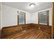 Bright bedroom with wood floors and ample natural light from two windows at 2206 Weepoolow Trl, Charleston, SC 29407