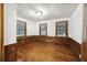 Bright bedroom with hardwood floors and three windows at 2206 Weepoolow Trl, Charleston, SC 29407