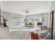 Spacious bedroom featuring large windows, access to balcony, ceiling fan and sitting area at 2206 Weepoolow Trl, Charleston, SC 29407