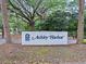 The Ashley Harbor neighborhood sign features lush landscaping and a welcoming entrance at 2206 Weepoolow Trl, Charleston, SC 29407