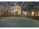 Stunning three-story home with double balconies and a lush landscaped lawn at 2206 Weepoolow Trl, Charleston, SC 29407