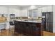 Modern kitchen with white cabinetry, stainless steel appliances, and a stylish breakfast bar at 2206 Weepoolow Trl, Charleston, SC 29407
