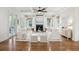 Bright living room with hardwood floors, coffered ceiling, and a cozy fireplace at 2206 Weepoolow Trl, Charleston, SC 29407